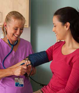 nurse measuring blood pressure